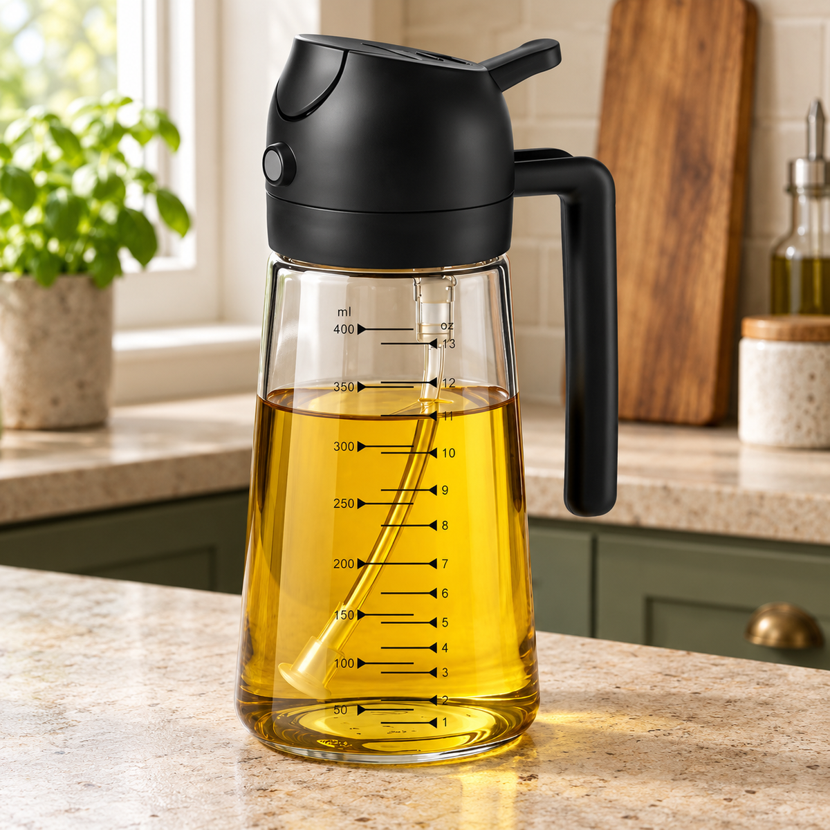 Clear glass oil sprayer with black handle and measurement markings on a kitchen counter